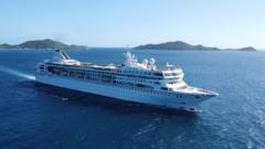 Luxury cruise ship Villa Vie Odyssey docked in Sihanoukville, Cambodia at sunset